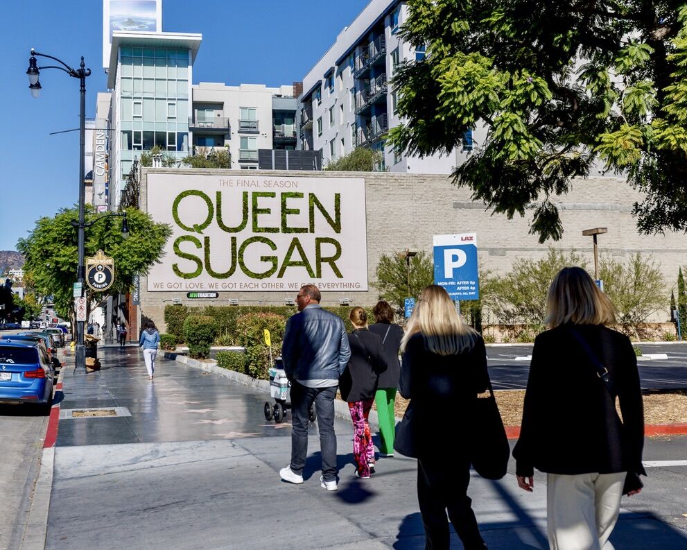 Queen Sugar final season living moss billboard on Hollywood Boulevard Los Angeles with pedestrians