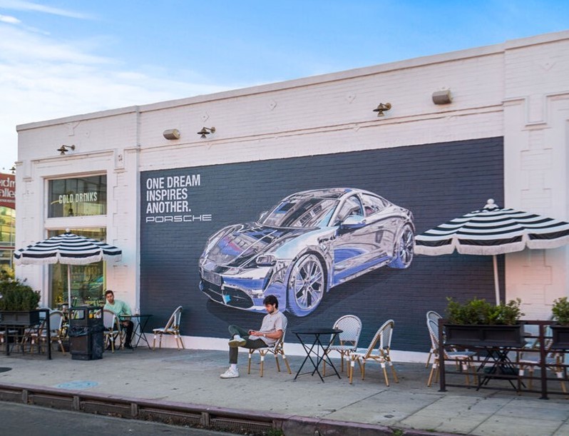 Hand-painted Porsche wall advertisement by Hoist Media