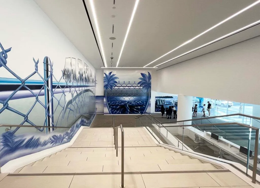 Wide view of large-scale blue mural installation at Hammer Museum in Los Angeles